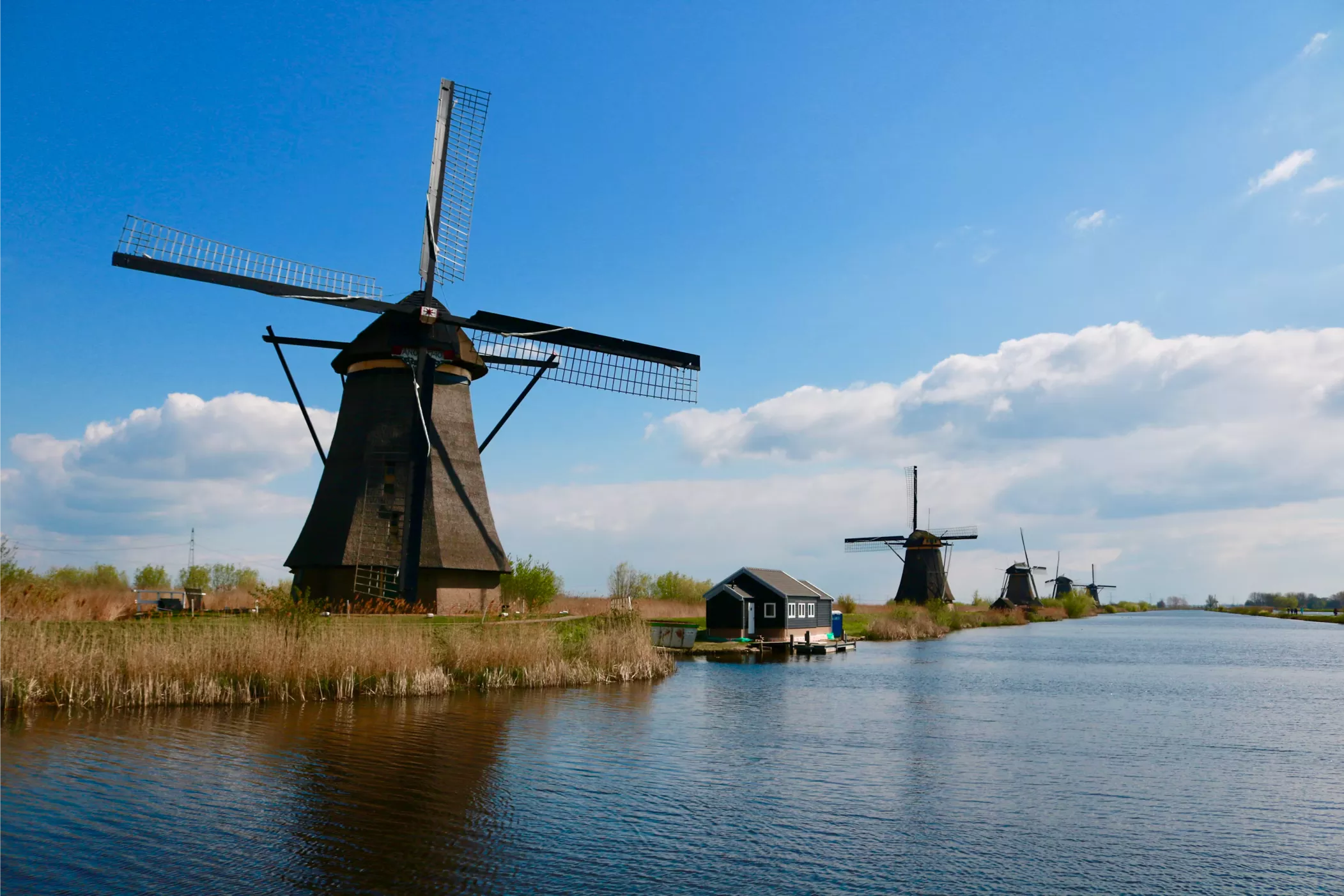 Dutch landscape with traditional mills and a water channel